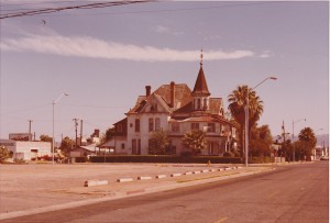 A picture of Rosson House just when restoration was starting in 1974, painted white and surrounded by parking lots.