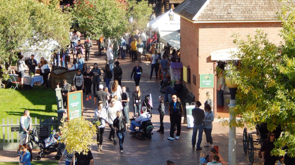 A busy festival at Heritage Square, surrounding the Visitor Center.
