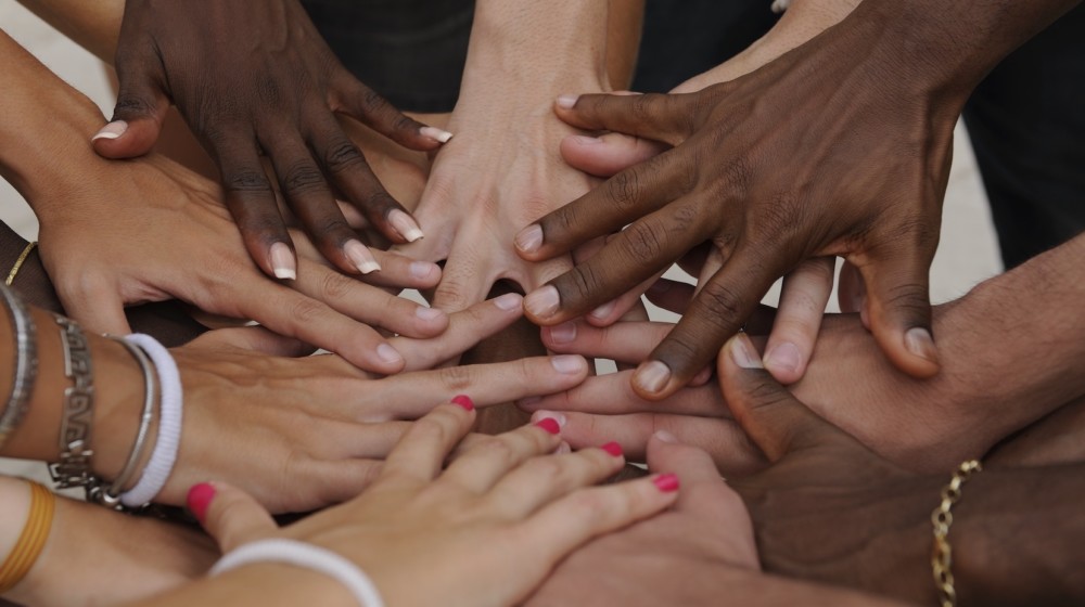 A picture of many hands together.