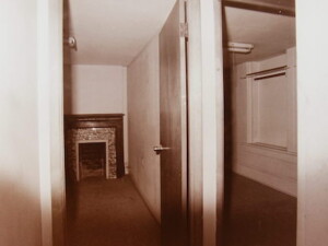 Rosson House's main bedroom before restoration, split up into two separate rooms.