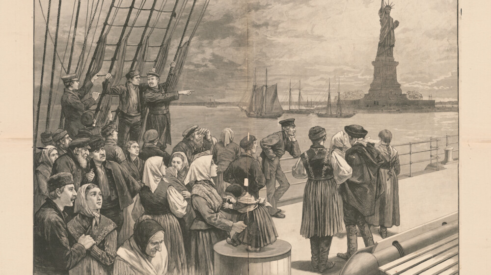 A sketch by a staff artist from Frank Leslie's Illustrated Newspaper in 1887, showing people on a ship looking at the Statue of Liberty. The text beneath the illustration reads, “New York – Welcome to the land of freedom – An ocean steamer passing the Statue of Liberty: Scene on the steerage deck”.