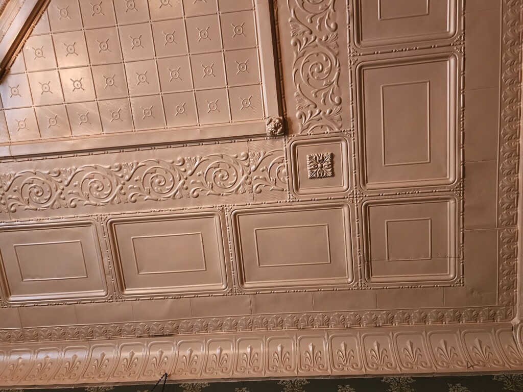 The ornamental metal ceiling in the Rosson House family parlor.