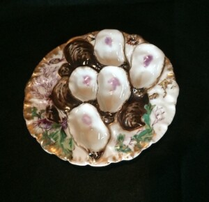 A picture of a 19th century hand-painted oyster plate.