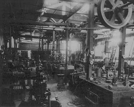 A black and white picture of an electrical generating factory, circa 1880.