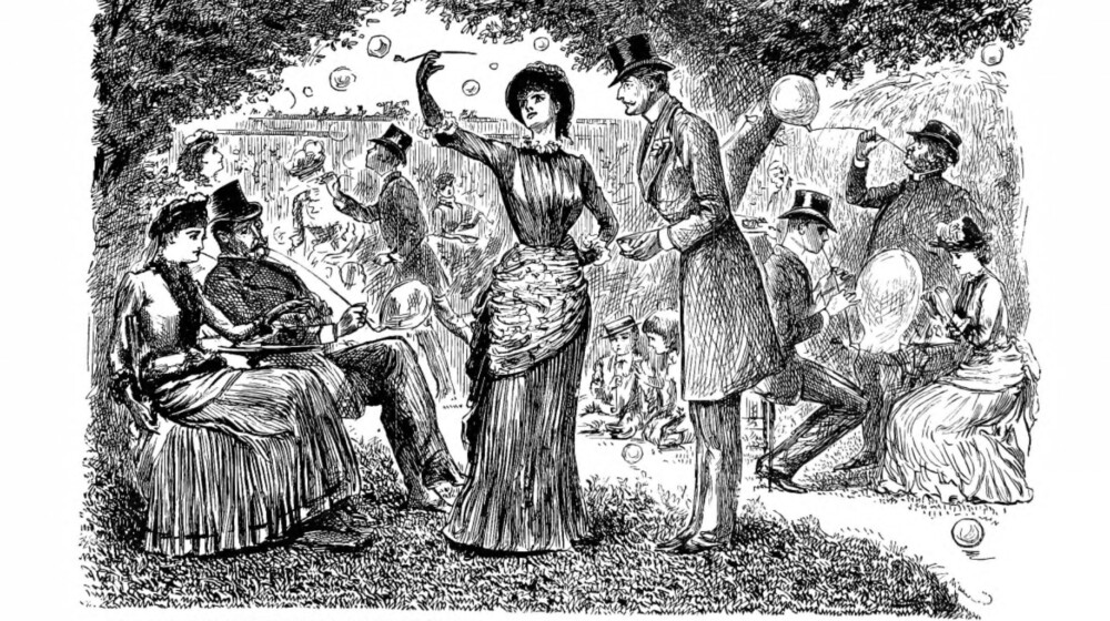 A black and white print of a drawing showing a Victorian Era bubble party, with various men and women blowing bubbles in a garden area.