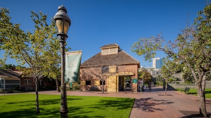 A picture of the Burgess Carriage House, where Heritage Square's Visitor Center is located.