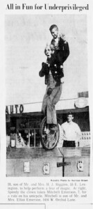 A newspaper clipping of a clown on a unicycle, carrying a young boy on his shoulders.