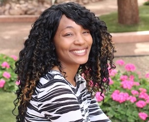 A photo of a smiling woman.